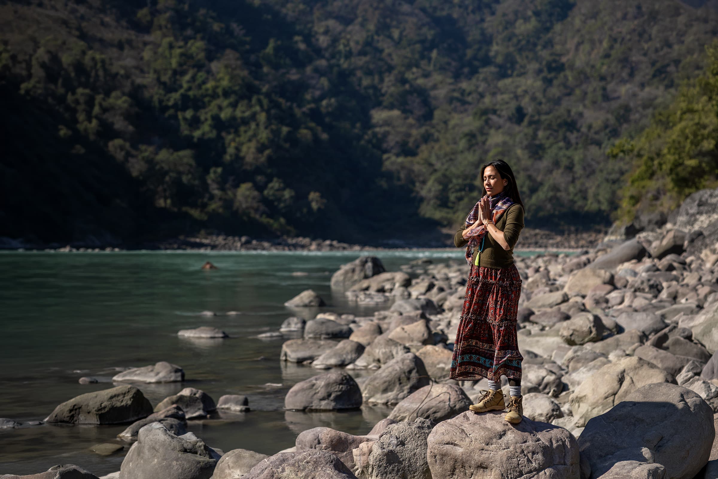 Stephanie Zubiri standing at the edge of the Ganges River
